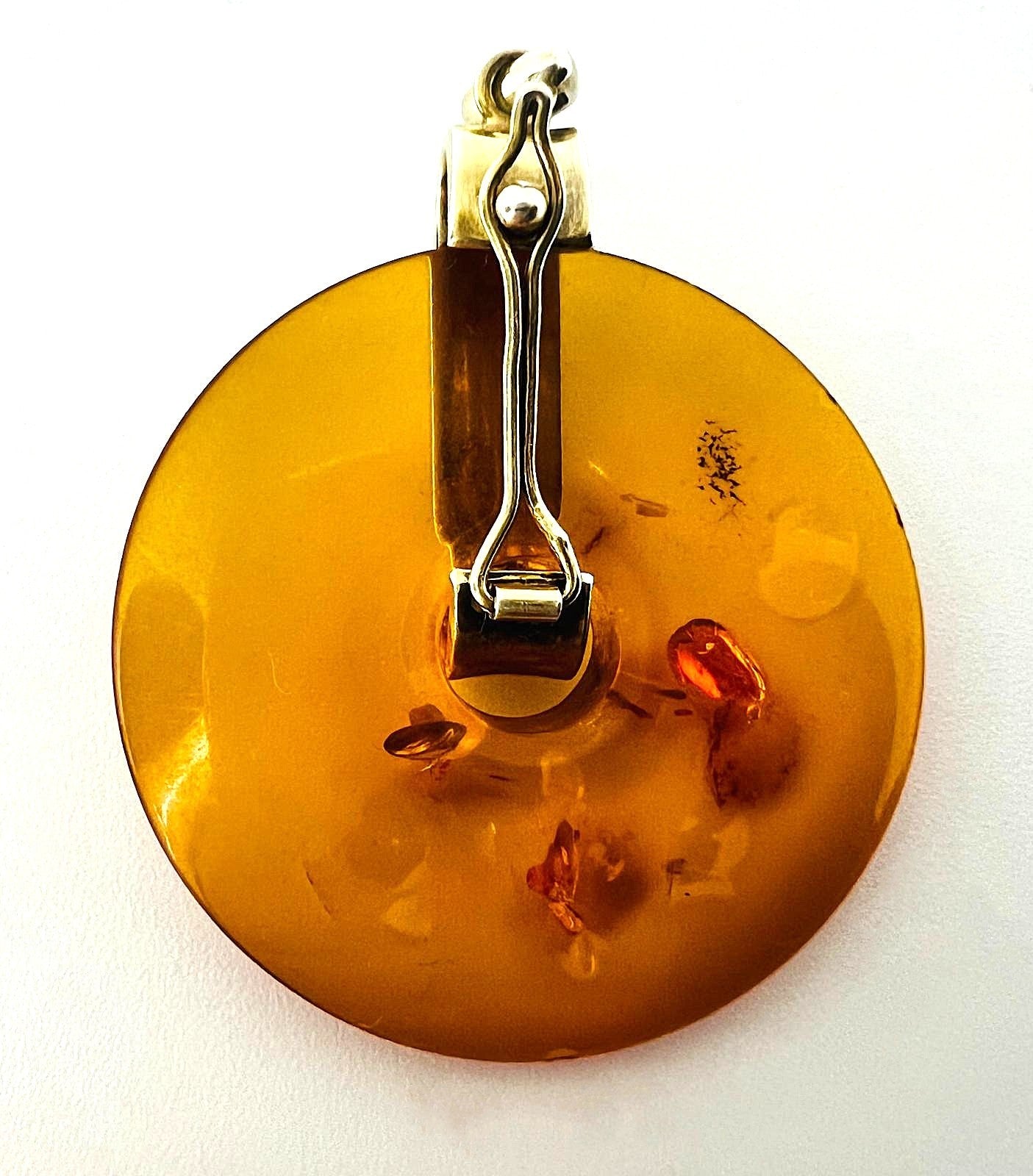 Bernstein Anhänger rund mit Mondstein