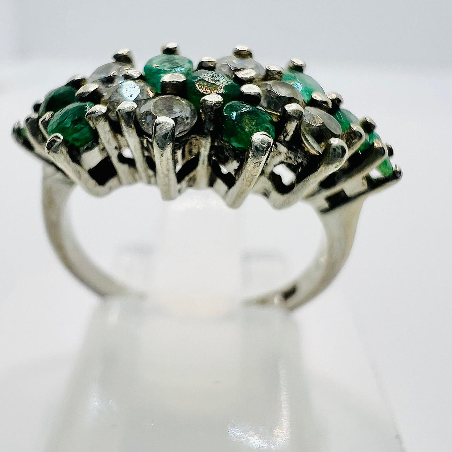 Art Deco unique silver ring with emerald gemstones and white zircons