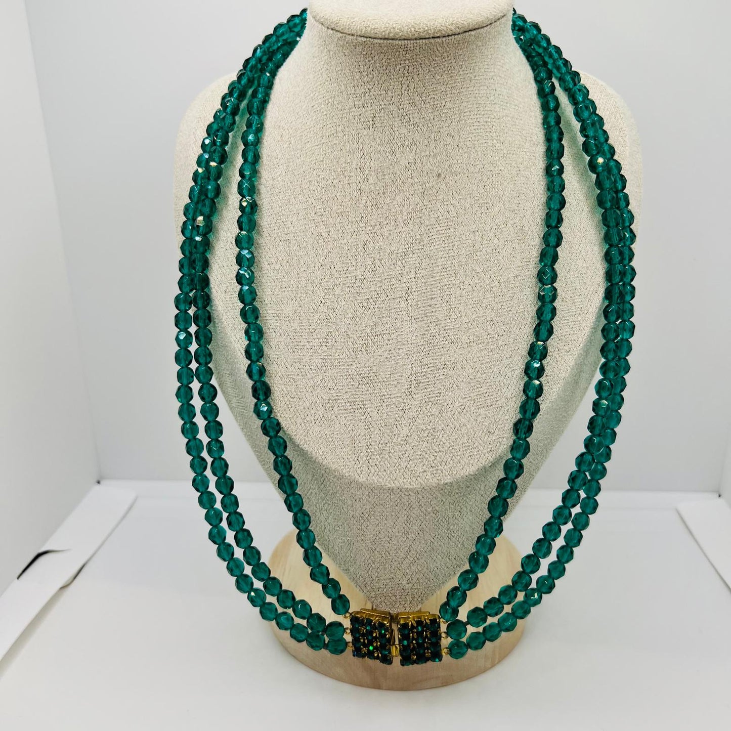 Handmade three-row vintage glass bead necklace with green faceted design
