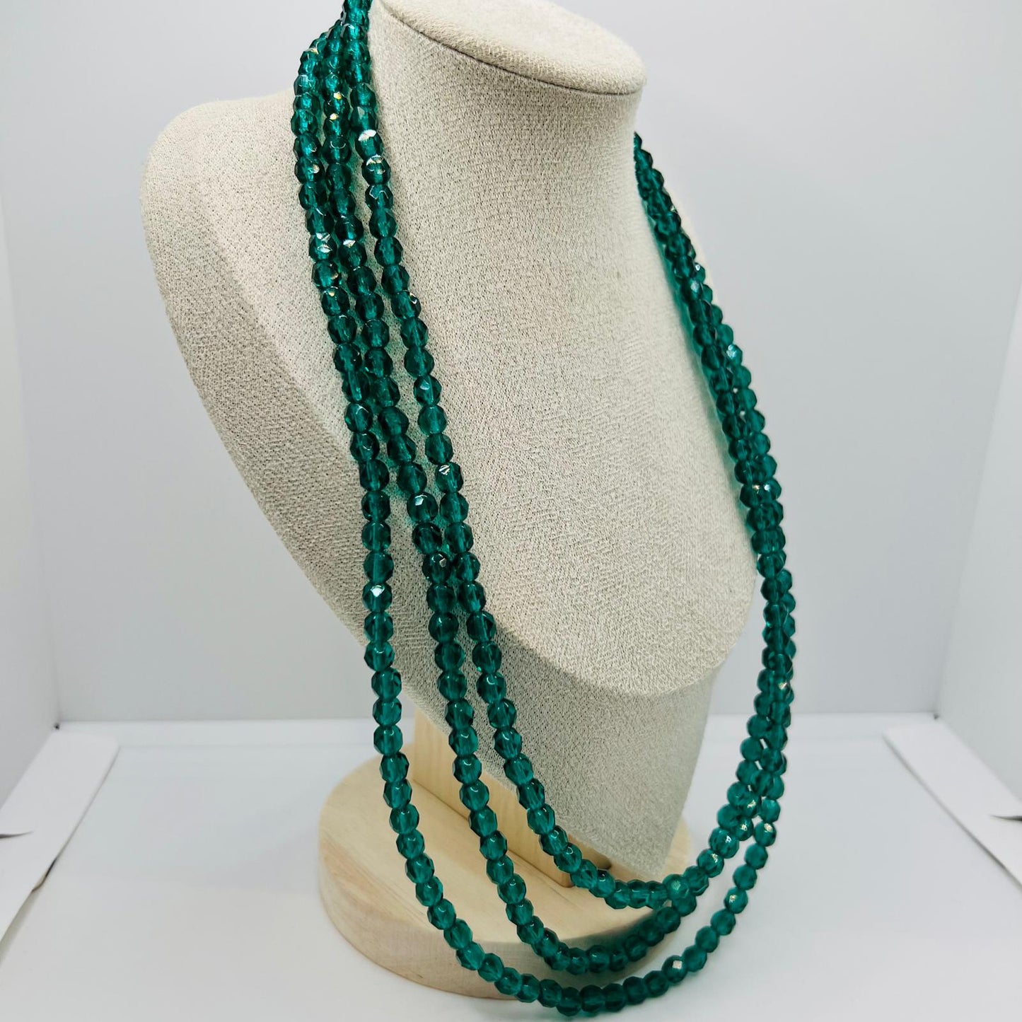 Handmade three-row vintage glass bead necklace with green faceted design