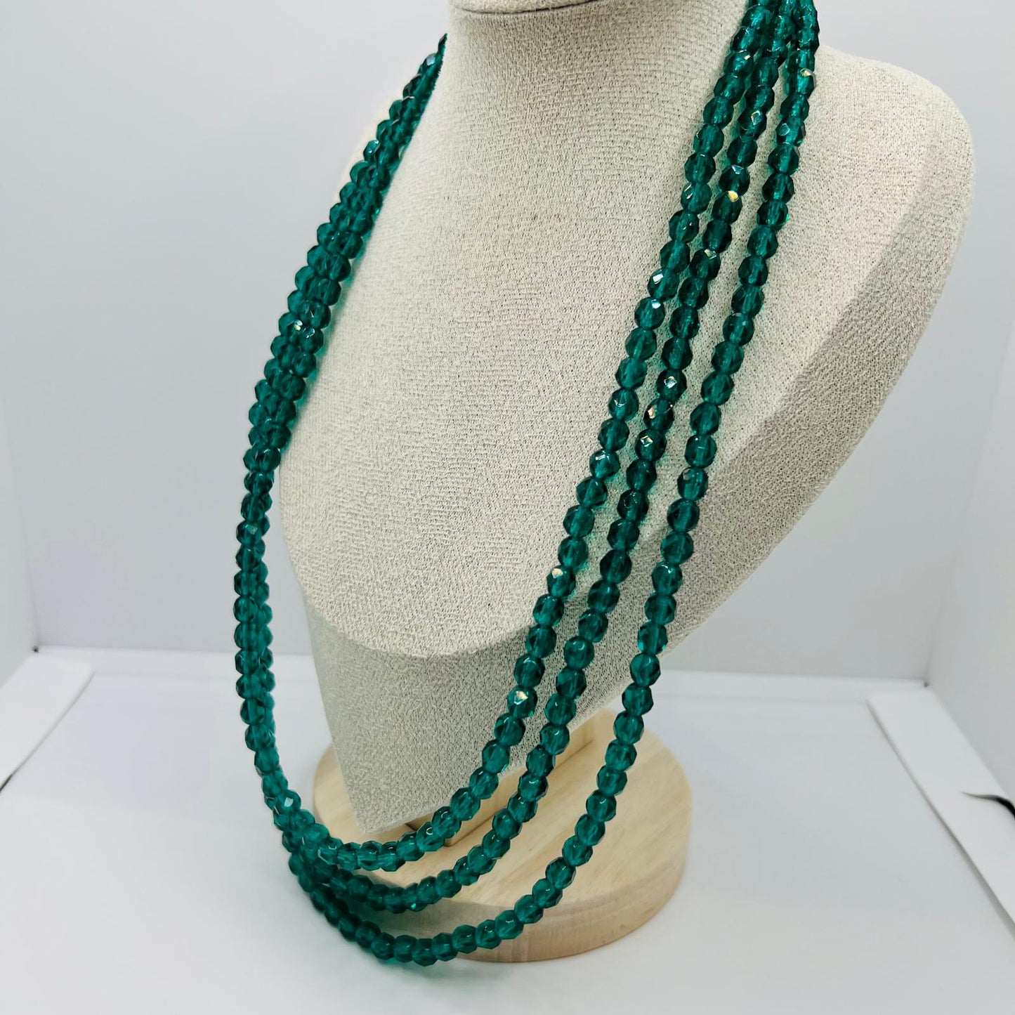 Handmade three-row vintage glass bead necklace with green faceted design