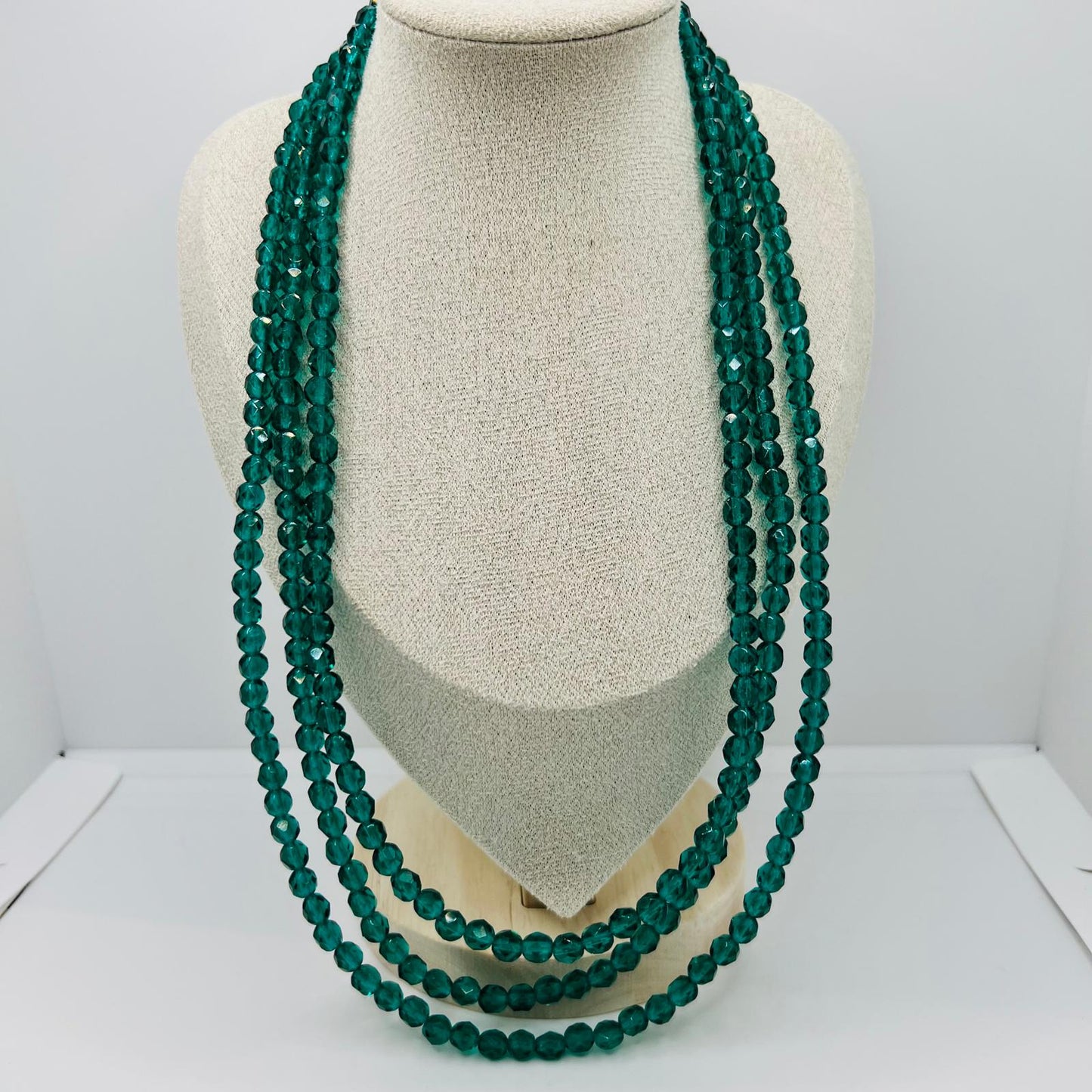 Handmade three-row vintage glass bead necklace with green faceted design