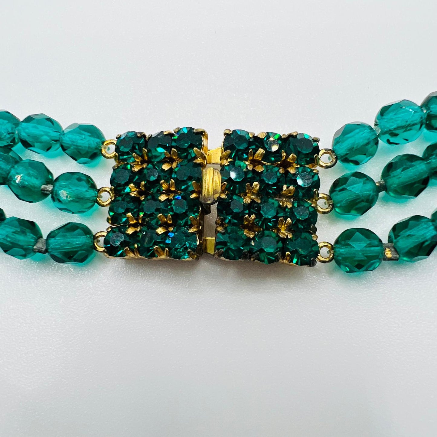 Handmade three-row vintage glass bead necklace with green faceted design